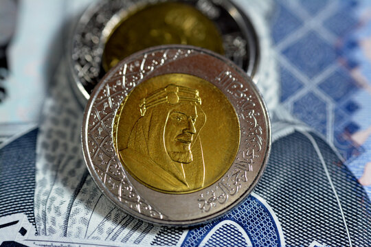 Obverse side of 2 SAR two Saudi Arabia riyals coin series 1438 AH 2016 features portrait of king AbdulAziz Bin AbdulRahman Al Saud the founder of dynasty of Al Saud and Multiple Coat of Arms isolated