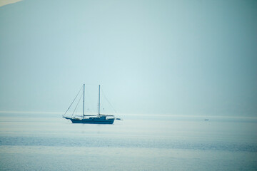 Sailing yacht on the ocean at sunny day