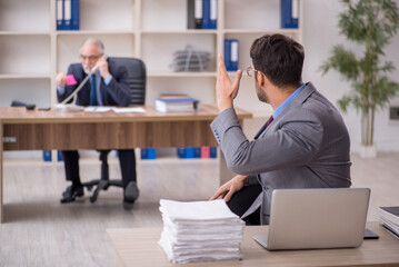 Two male colleagues working in the office