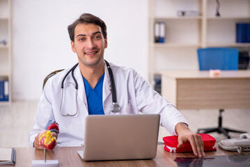 Young male doctor working in the clinic