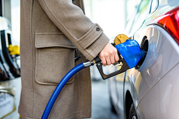 Korean Man Gasing at a Gas Station