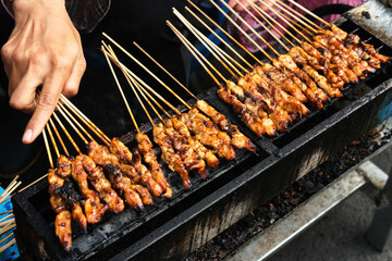 Sate Ayam (Chicken satay) with peanut sauce. One of the popular street food in Indonesia.
