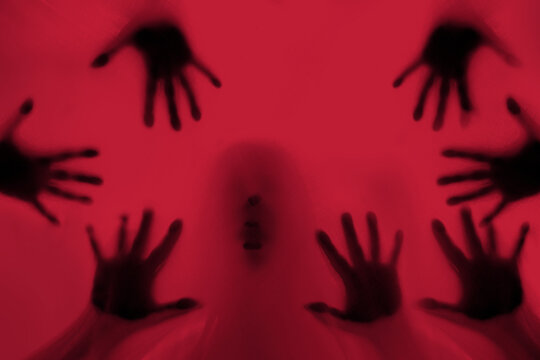 eerie blurry image of humanoids from other planets, frightening creatures that appear as if they have been trapped behind glass, dense fabric, wrap, alien trying to reach out from afterlife