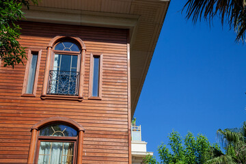 Facade of a typical Turkish wooden house in Istanbul, in a residential district. Wooden houses are traditional in turkish and ottoman architecture. ..