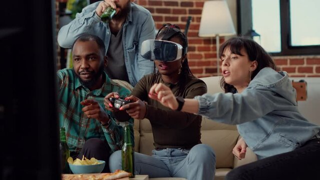 Diverse friends feeling sad about losing video games play with vr glasses and tv console at home gathering. Frustrated people using virtual reality headset to lose challenge. Handheld shot.