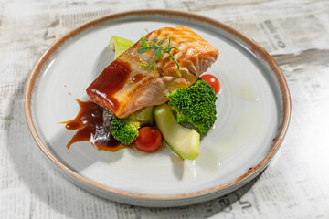 Salmon fillet served with vegetables
