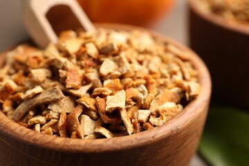 Bowl of dried orange zest seasoning, closeup
