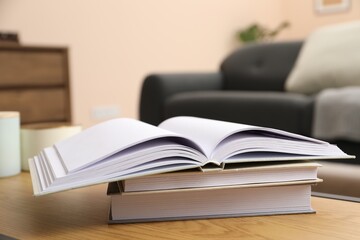 Books on wooden table in living room