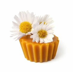 Natural beeswax cake block and flower isolated on white