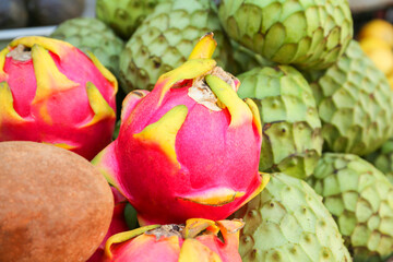 Cherimoya, sapodilla and dragon fruit at market, closeup. Space for text