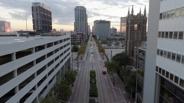 Aerial view over the main street in middle of buildings in Houston, sunset in USA