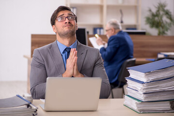 Two male colleagues working in the office
