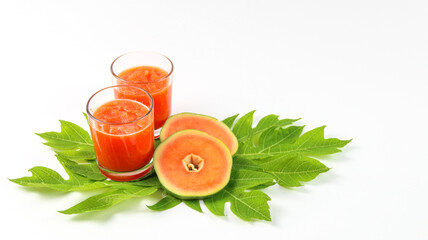 Papaya smoothie in glass jar and glasses on white background diet vegetarian healthy and freshness drink concept soft and selective focus