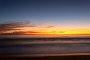 Yellow sunset on the beach. seascape for background. colorful sky. beautiful water reflection. sunlight