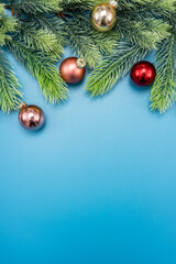 Christmas composition. festive decor on blue background. Copy space, flat lay, top view.