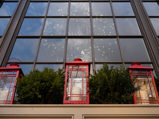 Red Holiday and Christmas Lanterns in front a large window in historic Bethlehem Pennsylvania