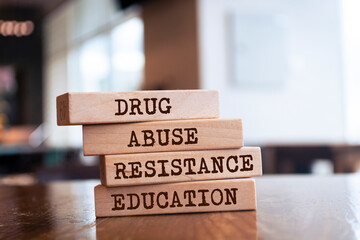 Wooden blocks with words 'DRUG ABUSE RESISTANCE EDUCATION'.