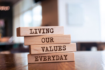 Wooden blocks with words 'LIVING OUR VALUES EVERYDAY'.
