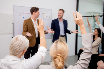 Young caucasian businessman asking opinion and brainstorm of employee while raise hand up for...