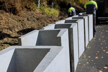 In order to water drain reconstruction road, precast concrete u-shaped drains were installed along...