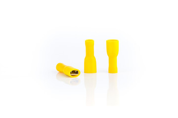 Wire connector, Yellow insulated Female Connector isolated on white background with clear shadow reflect.