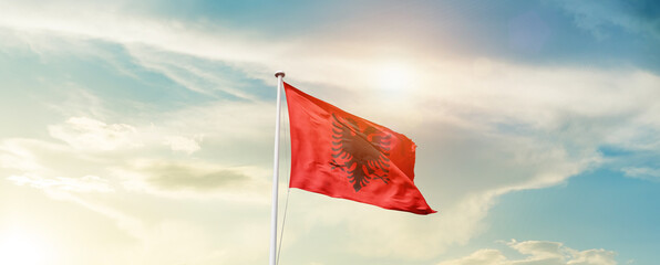 Waving Flag of Albania with beautiful Sky.