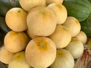 Fresh ripe honey juicy melon in market closeup