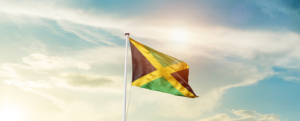 Waving Flag of Jamaica with beautiful Sky.