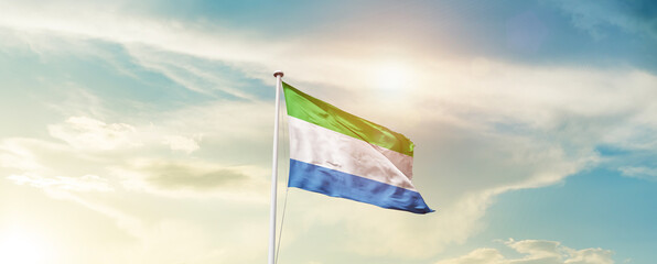 Waving Flag of Sierra Leone with beautiful Sky.