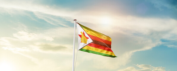 Waving Flag of Zimbabwe with beautiful Sky. - obrazy, fototapety, plakaty