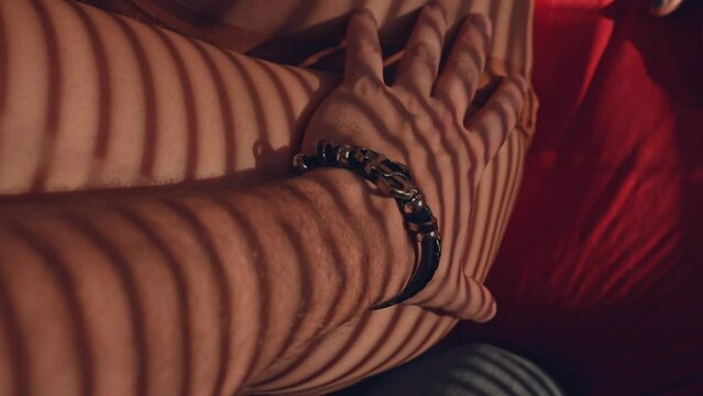 Male passionately touches female in bed