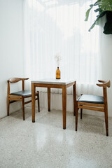 Wooden chairs and table in coffee shop and restaurant background. wood design, decoration and interior in house.