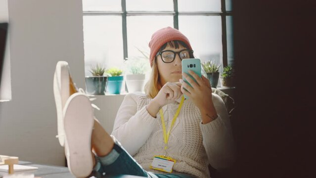 Office Woman, Phone And Feet Up At Workplace Desk Reading, Chat Or Streaming Online For Social Media, Communication Or News. Creative Employee Relax With Network And Handheld Movement At Business