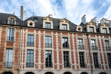 Paris, place des Vosges, beautiful buildings in a touristic place
