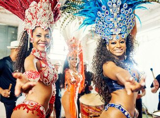 Portrait of women, samba and carnival band in Brazil for celebration, mardi gras and party. Salsa dancers, happy group and music festival performance in rio de janeiro for culture, concert and show - obrazy, fototapety, plakaty