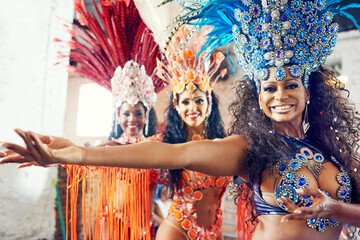 Brazilian women, group or carnival dancers in performance practice, festival dance or Rio de Janeiro party. Portrait, happy smile or samba girls in fashion clothes, sequence bras or feather headdress