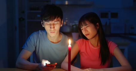 asian couple with power outage