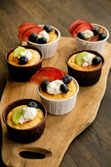 fresh cupcakes with fruits and berries