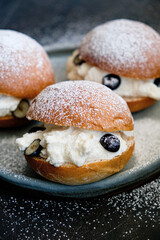 Homemade choux cream or cream puffs with custard cream