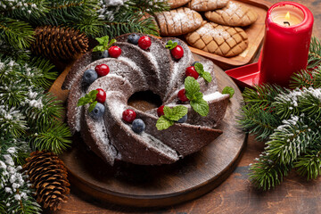 Christmas cake with blueberries, cranberries and mint