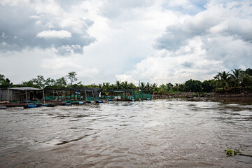 Fototapeta na wymiar Floating Fish Farm on the Mekong River