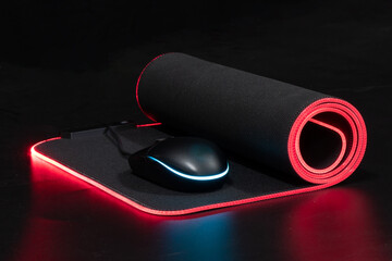 large flexible backlit mouse pad on a dark background