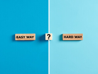 Dilemma or choice between choosing the easy or hard way concept.