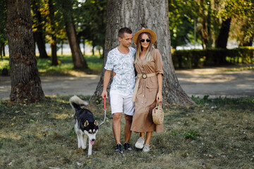 Young couple and husky