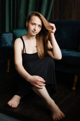 Portrait of gorgeous female brunette model posing in white fashion clothes in studio