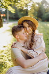 Young couple in love outdoor.Stunning sensual outdoor portrait of young stylish fashion couple posing in summer in field
