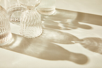 close up of minimal setup of glassware on trendy beige background