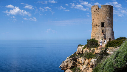 Fototapeta na wymiar tourists visiting Cap Blanc tower built in 1579, llucmajor, Mallorca, Balearic Islands, Spain