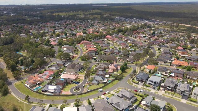 Aerial drone view of Voyager Point in South West Sydney, NSW Australia heading toward the train line and Heathcote Road  