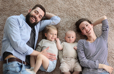 happy family mother father and kids at home